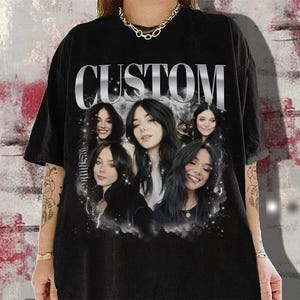 May include: Black t-shirt with a graphic print of five women with the word "CUSTOM" in large silver letters.