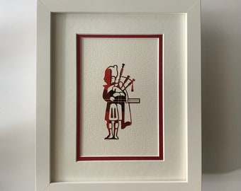 ARTWORK. Ramsay Clan / Tartan. The Bagpiper. Matted / Framed Diecut Vintage Print Scottish Scotland / Plaid / Red Green White / Bagpipe