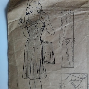 May include: Vintage sewing pattern for a sleeveless dress with a dotted pattern. The pattern includes instructions and diagrams for cutting and sewing the dress. The pattern number is 4042.