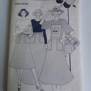 May include: A sewing pattern for a dress with a bib front and pockets. The pattern is from Woman's Weekly and is size 12. The pattern number is B 702.