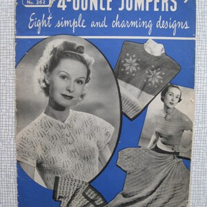 May include: A vintage knitting pattern booklet with a blue cover featuring a woman wearing a knitted jumper and the text "4-OUNCE JUMPERS 9d. Eight simple and charming designs."