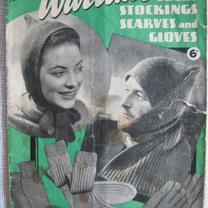 May include: A vintage knitting pattern booklet titled "Wartime Socks Stockings Scarves and Gloves" with a price of 6 pence. The cover features a woman wearing a knitted hat and a man wearing a knitted hat and scarf. The booklet includes images of knitted socks, stockings, scarves, and gloves.