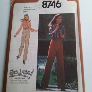 May include: Simplicity sewing pattern number 8746 for a pair of trousers. The pattern includes instructions for beginners and is for size 10, with a waist measurement of 64 cm. The pattern features two models wearing different versions of the trousers.