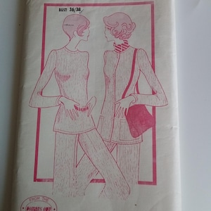 May include: Vintage sewing pattern with a pink illustration of two women in matching outfits. The pattern is for a bust size 91/97 cm. The text reads "A Suzanne Grey Pattern WO 5249" and "From the Woman's Own Service Centre."