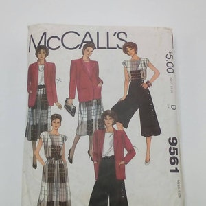 May include: McCall's sewing pattern number 9561, size 10, for a miss, featuring four different outfits: a red blazer with a black and white plaid skirt, a black and white plaid dress with a black belt, a white top with black and white plaid culottes, and a red blazer with black culottes.