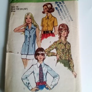 May include: Vintage Simplicity sewing pattern number 5022 for a women's blouse. The pattern includes three different styles: a sleeveless blouse with a collar, a short-sleeved blouse with a collar, and a long-sleeved blouse with a collar. The pattern is for sizes 18, bust 40 inches.