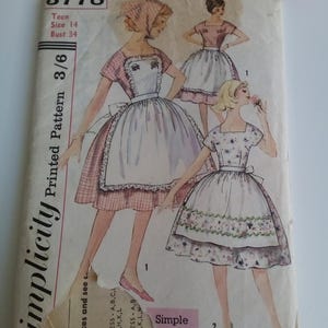 May include: Vintage Simplicity sewing pattern for a teen dress, size 14, bust 34. The pattern includes three different styles of dresses with a gingham and floral print. The pattern number is 3778.