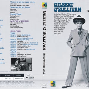 May include: DVD of Gilbert O'Sullivan's "The Anthology vol.2" album. The cover features a black and white image of the artist in a suit and hat. The DVD case has a list of songs and a "Collector's Set" label.