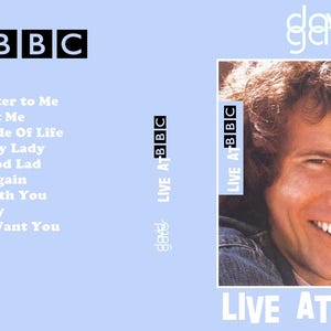 May include: DVD cover for "Live at BBC" by David Gates. The cover features a smiling man with brown hair, the text "Live at BBC" in white, and a list of song titles. The background is light blue.