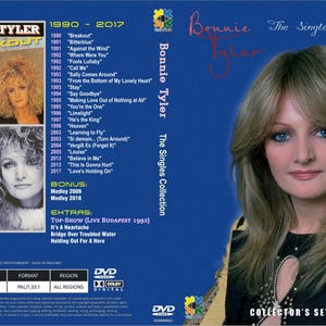 May include: A blue DVD case for the Bonnie Tyler The Singles Collection, featuring a portrait of the artist on the front and back. The back cover lists tracks from 1990 to 2017, bonus tracks, and technical specifications including English language and Dolby Digital.