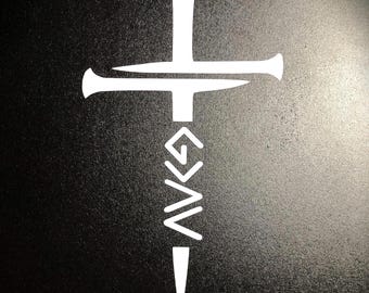 May include: White silhouette of a cross with a nail design, the nail is shaped like a dagger with a series of V shapes down the length of the blade.