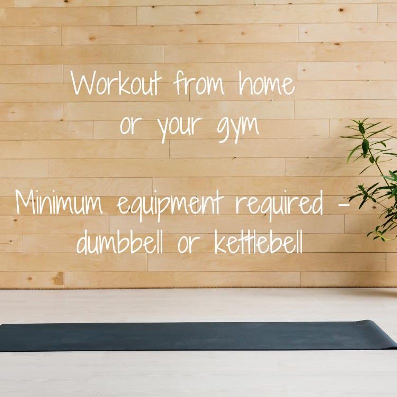 May include: Workout from home or your gym. Minimum equipment required - dumbbell or kettlebell. A black yoga mat is on a wooden floor.