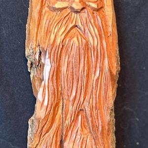 Hand carved wood spirit wall hanging