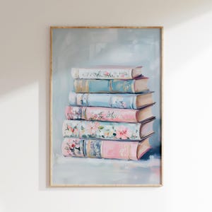 Pode incluir: Uma pilha de livros vintage com capas de padrões florais em tons de rosa, azul e branco. Os livros estão dispostos em forma de pirâmide sobre um fundo azul claro.