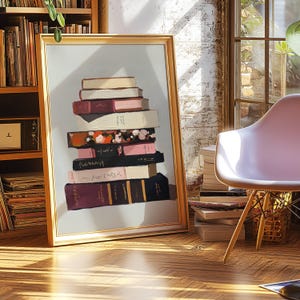May include: A painting depicting a stack of books against a light blue background. The books are arranged in a pile, with the top book being a light brown colour. The other books are in a variety of colours, including pink, white, and black. The books are all different sizes and shapes. The painting is framed in a gold frame.