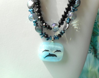 Dancing Dolphins ... blue glass pendant, dolphins, jet glass ... #610