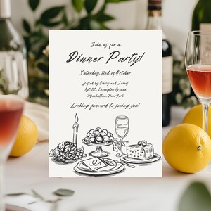 以下が含まれることがあります： 「Join us for a Dinner Party!」というテキストが書かれた、白黒のディナーパーティー招待状のイラスト。土曜日、10月22日。エミリーとジェームズ主催。Apt 12C. Lexington Avenue. Manhattan. New York. お会いできるのを楽しみにしています！