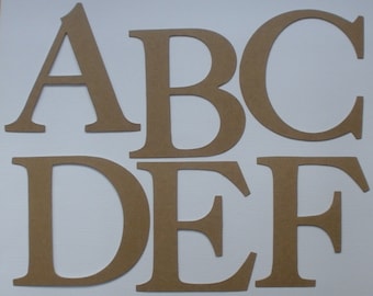 May include: Six brown wooden letters, A, B, C, D, E, and F, are arranged in two rows on a white background. The letters are cut out of wood and have a simple, classic font.