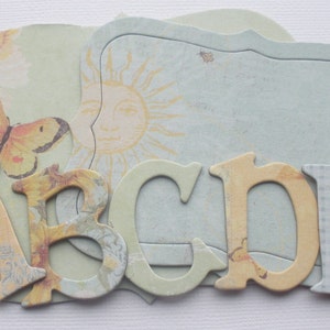 165 Pc. SUN KISS - Chipboard Alphabet Letters & Beautiful Embellishments Kit  -  1.5&quot; inch Letters