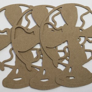 May include: Three brown paper cutouts of globes, each with a detailed outline of the continents and oceans. The globes are stacked on top of each other, with the top globe slightly offset to the right.