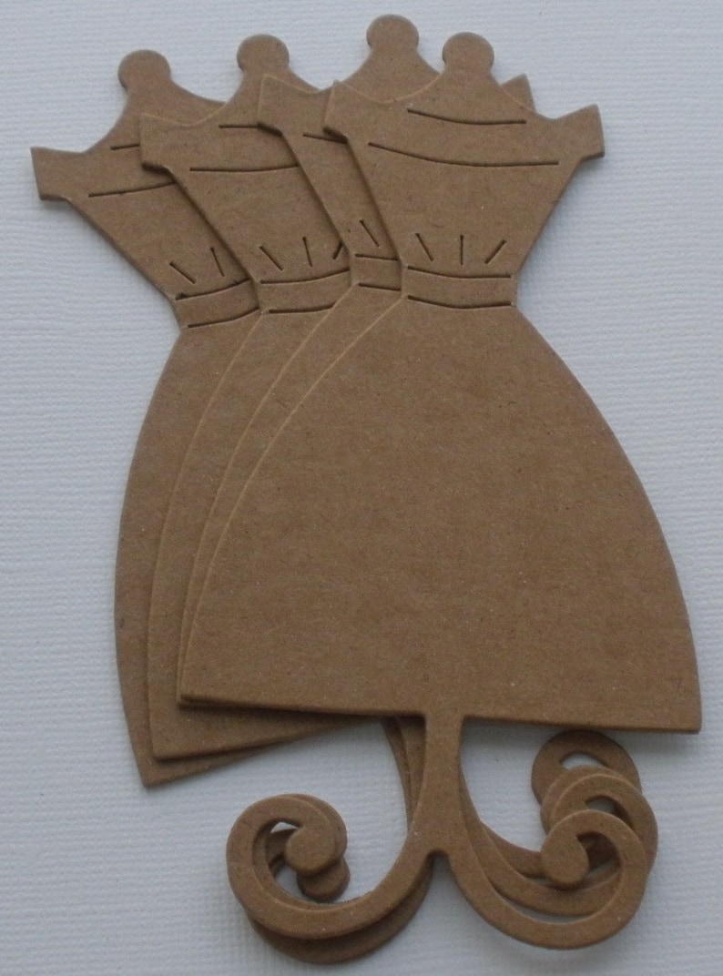 May include: Five brown paper dress cutouts with a decorative swirl at the bottom. The dress cutouts are stacked on top of each other.