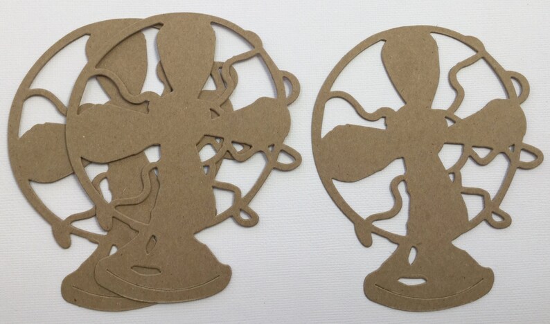 May include: Three brown paper cutouts of vintage fans. The fans have a circular shape with a decorative design and a stand.