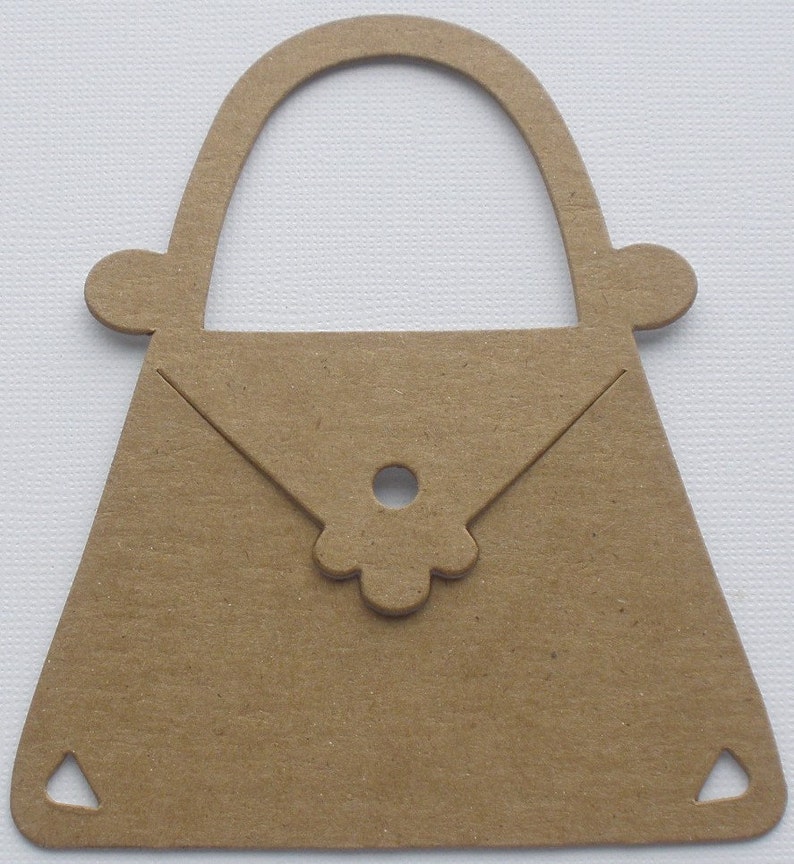 May include: A brown paper cutout of a handbag with a simple flower design on the flap.