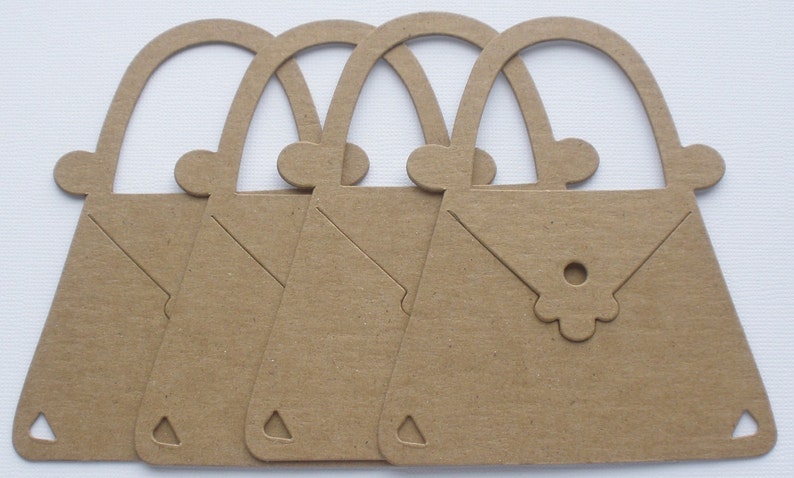 May include: Four brown paper cutouts of handbags with a flower detail on the front. The handbags are all the same size and shape.