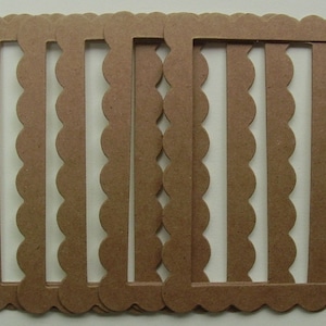 May include: A set of six brown scalloped paper frames. The frames are all the same size and have a scalloped edge.