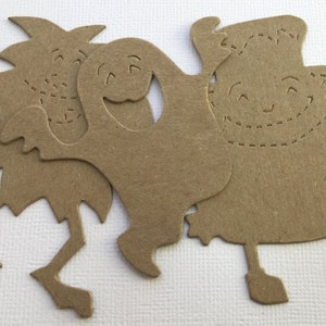May include: Three brown paper cutouts of friendly ghosts with stitched details. The ghosts have smiling faces and are in various poses.