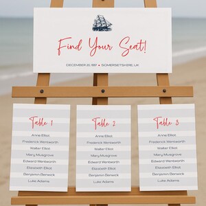 May include: A white sign with the text "Find Your Seat!" and a nautical ship illustration. The sign is on an easel and lists names for three tables: Table 1, Table 2, and Table 3.