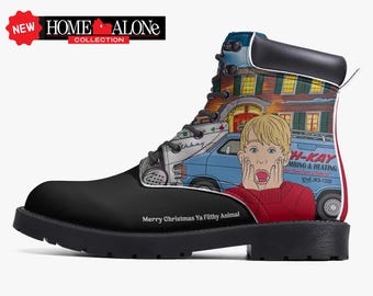 May include: Black combat boot featuring a graphic from the Home Alone Collection. The design includes a cartoon image of a shocked boy, a house, and a van. Text on the boot reads "Merry Christmas Ya Filthy Animal."
