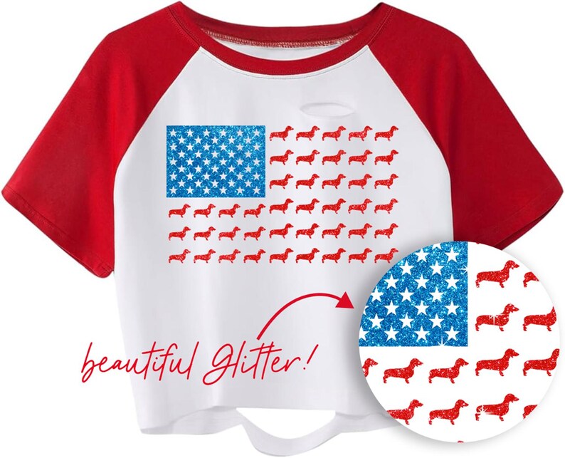 May include: White and red raglan t-shirt featuring a design of the American flag. The flag's stars are blue glitter, and the stripes are red dachshunds. The words "beautiful Glitter!" are written in red script.