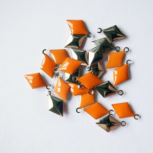 50 pcs of diamond shape hand cast poly resin drop in bright orange on steel tone plating brass base 12.5x7.5 mm