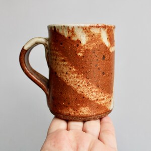 Classic Shino Glaze Stoneware Mug w/ an 11oz Capacity, Handcrafted Studio Pottery Mug, Organically Patchy Matte Grey & Orangey Rusty Glaze
