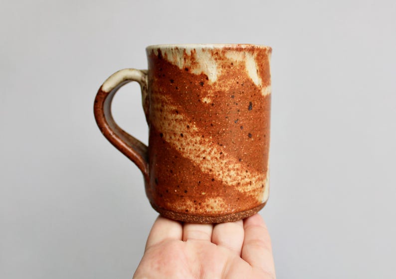 Classic Shino Glaze Stoneware Mug w/ an 11oz Capacity, Handcrafted Studio Pottery Mug, Organically Patchy Matte Grey & Orangey Rusty Glaze
