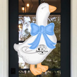 Op de afbeelding: Een witte keramische mok met een kleurrijk bloemmotief. De mok heeft een oor en is bedoeld voor warme dranken. Het bloemmotief bevat roze, gele en blauwe bloemen.