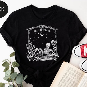 Read in Peace T-Shirt, Skeleton Book Shirt, Skeleton Reading T-Shirt, Bookish Halloween Shirt, Book Lover Halloween, Halloween Teacher Tee
