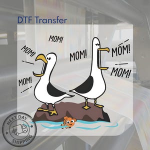May include: DTF Transfer design with two cartoon seagulls on a rock, shouting "MOM!". An orange and white fish swims below. The design includes a "Next Day Shipping" graphic. The text "DTF Transfer" is also present.