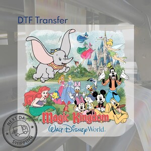 May include: A DTF transfer sheet featuring a colorful illustration of Dumbo, Tinker Bell, Peter Pan, Ariel, Flounder, Sebastian, Aurora, Cinderella, Daisy Duck, Donald Duck, Minnie Mouse, Mickey Mouse, Goofy, and Pluto in front of a castle with the text Magic Kingdom Walt Disney World.