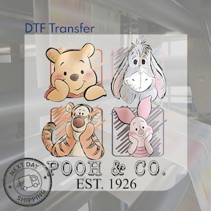 May include: DTF Transfer featuring four cartoon character illustrations: Winnie the Pooh, Eeyore, Tigger, and Piglet. The image includes the text "POOH & CO. EST. 1926" and a "NEXT DAY SHIPPING" stamp.