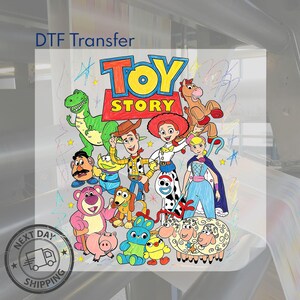 May include: A DTF transfer sheet featuring a colourful graphic of Toy Story characters including Woody, Buzz, Jessie, Rex, and others. The design has a hand-drawn aesthetic with vibrant colours and the Toy Story logo at the top. The background is white.