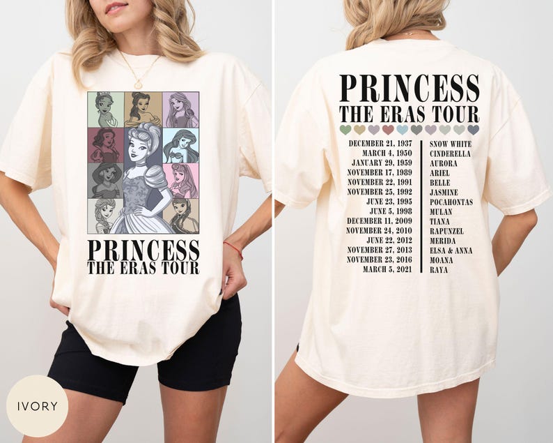 May include: Ivory-colored t-shirt featuring a graphic of Disney princesses in a grid, with the text "PRINCESS THE ERAS TOUR." The back of the shirt lists dates and princess names. A casual, oversized fit.