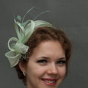 Light green fascinator.Green fascinator. Made to order.