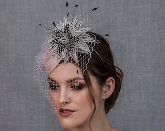 Pink wedding hat with feather flower. Pink fascinator hat.