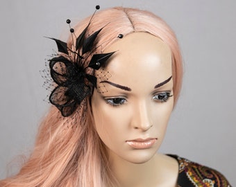 Black fascinator. Black feather fascinator with net and pearls. Popular design now also available in black colour!