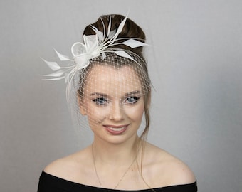 White feather fascinator. White bridal fascinator. White wedding fascinator. New style for 2023 formal occasions.