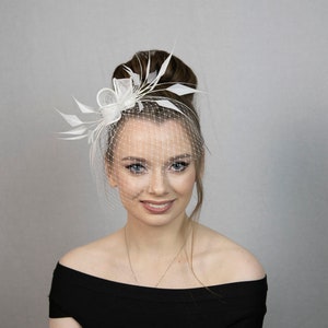 White feather fascinator. White bridal fascinator. White wedding fascinator. New style for 2023 formal occasions.