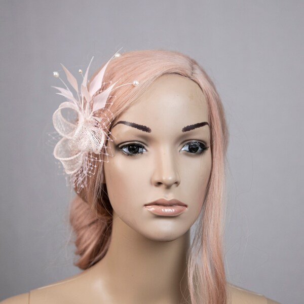 Light pink feather fascinator. Pale pink hair clip with pearls.