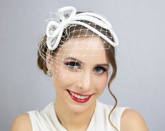 Minimalist bridal headpiece. Ivory white wedding fascinator with face veil.